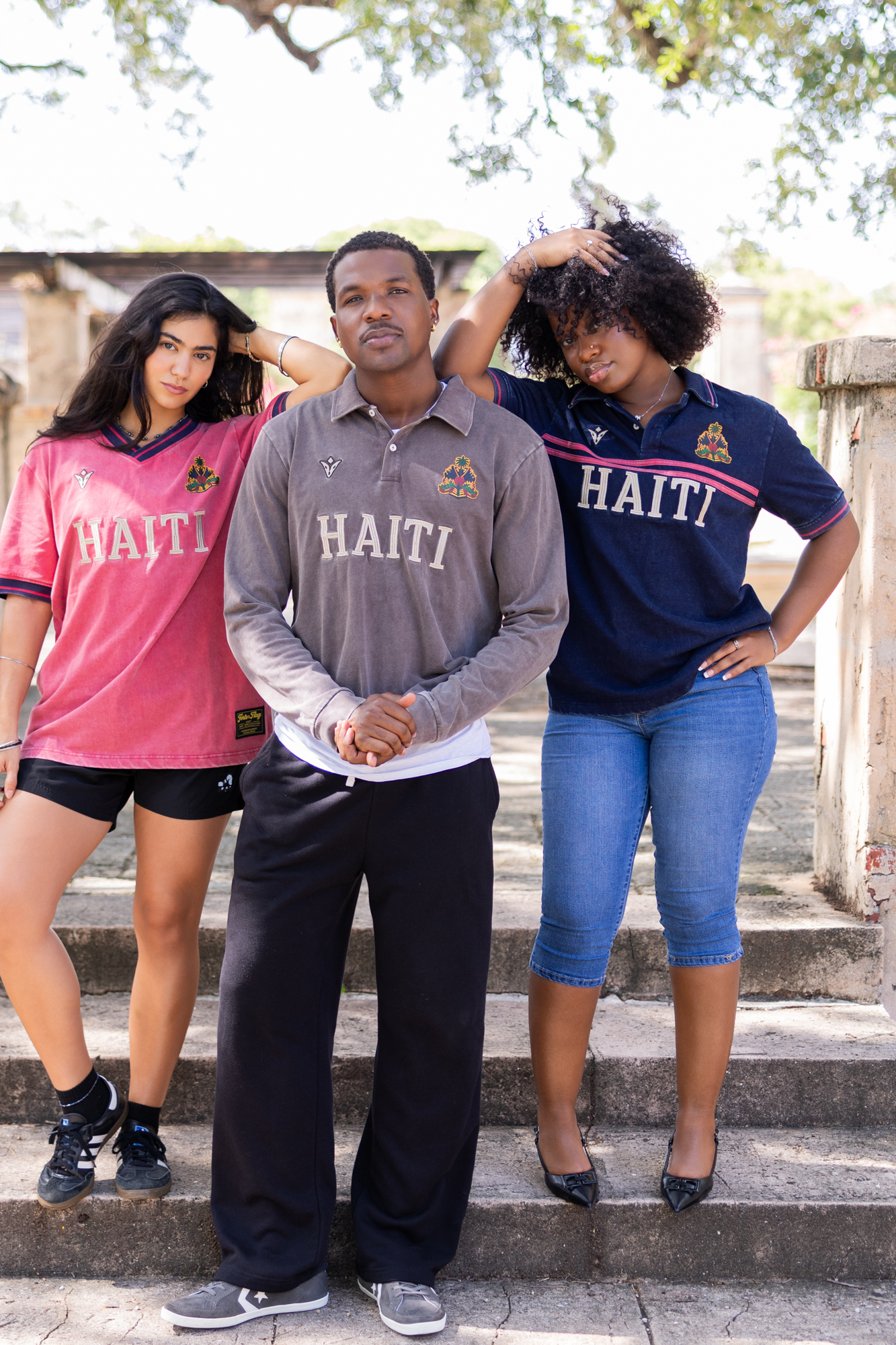 The crew in rose, charcoal and navy on the steps